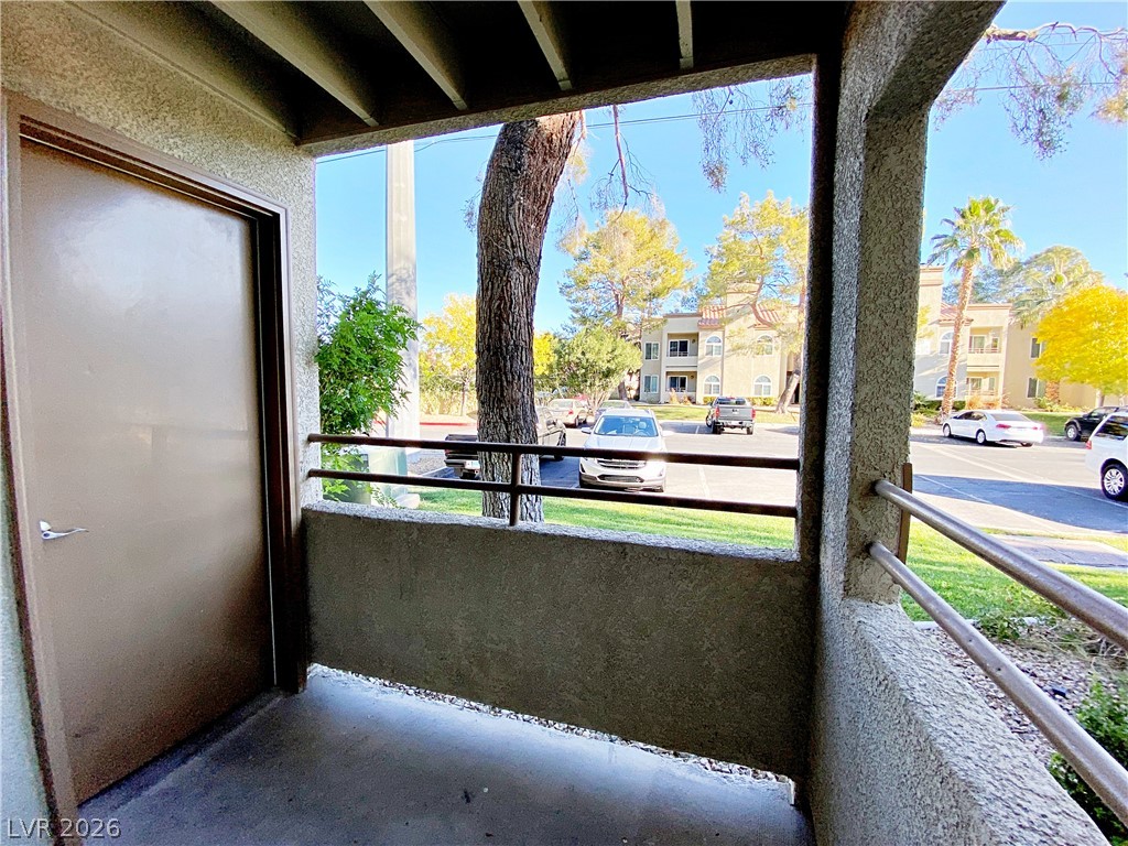 3145 East Flamingo Road, Unit 1128 Las Vegas, NV 89121 - Photo 16 of 19 A private patio offers serene views of the surrounding community and lush trees.