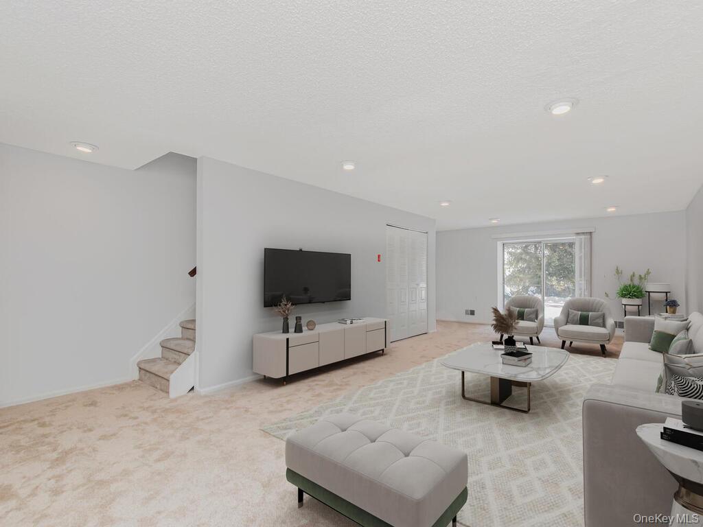 31 Winchester Avenue Peekskill, NY 10566 - Photo 11 of 33 a living room with furniture and a flat screen tv