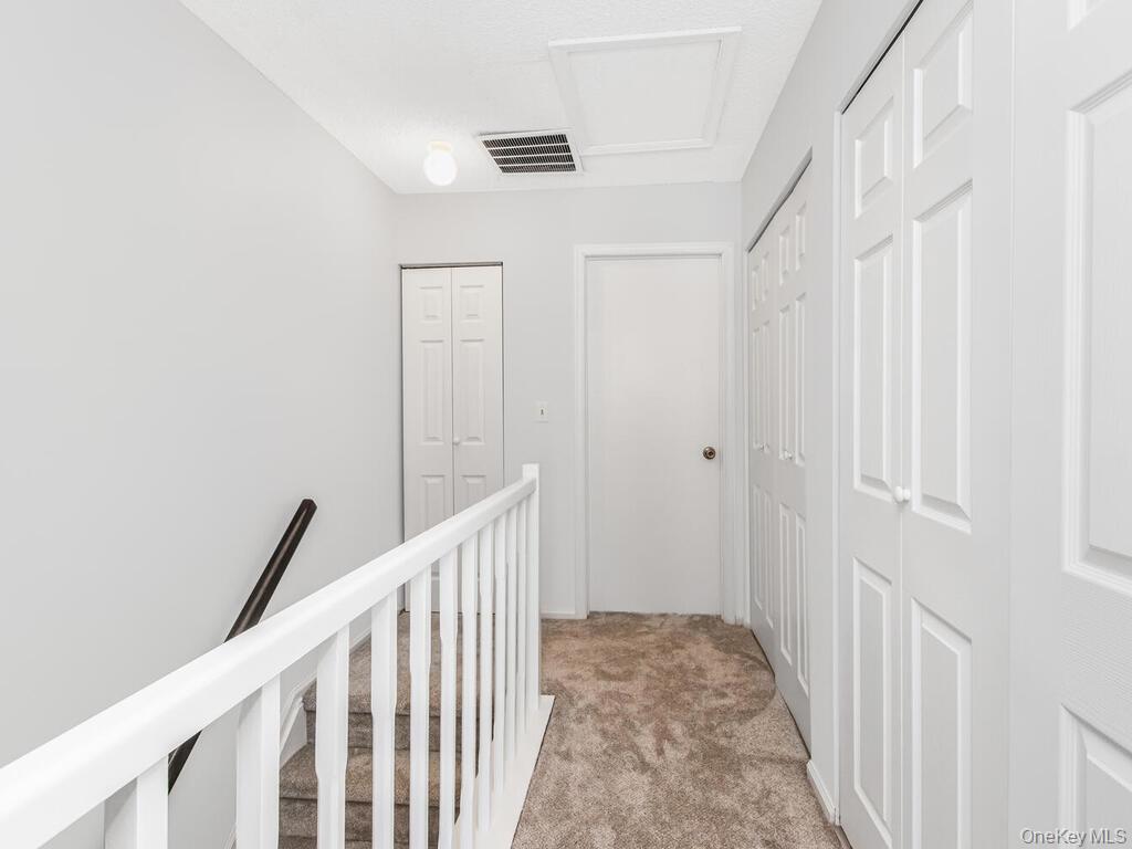 31 Winchester Avenue Peekskill, NY 10566 - Photo 14 of 33 a view of a hallway with wooden floor and entryway