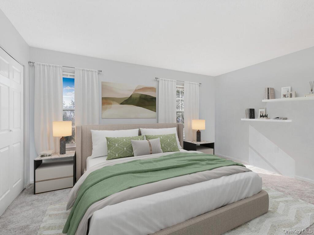 31 Winchester Avenue Peekskill, NY 10566 - Photo 15 of 33 a bedroom with a bed and a painting on the wall