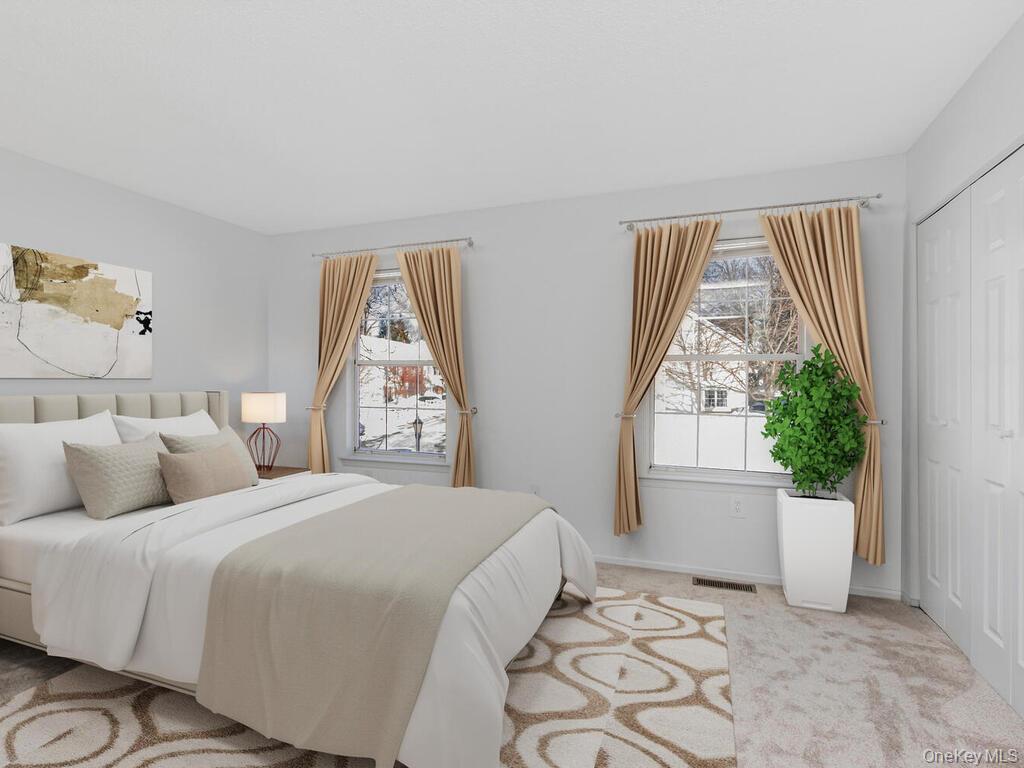 31 Winchester Avenue Peekskill, NY 10566 - Photo 17 of 33 a bedroom with a bed and a window