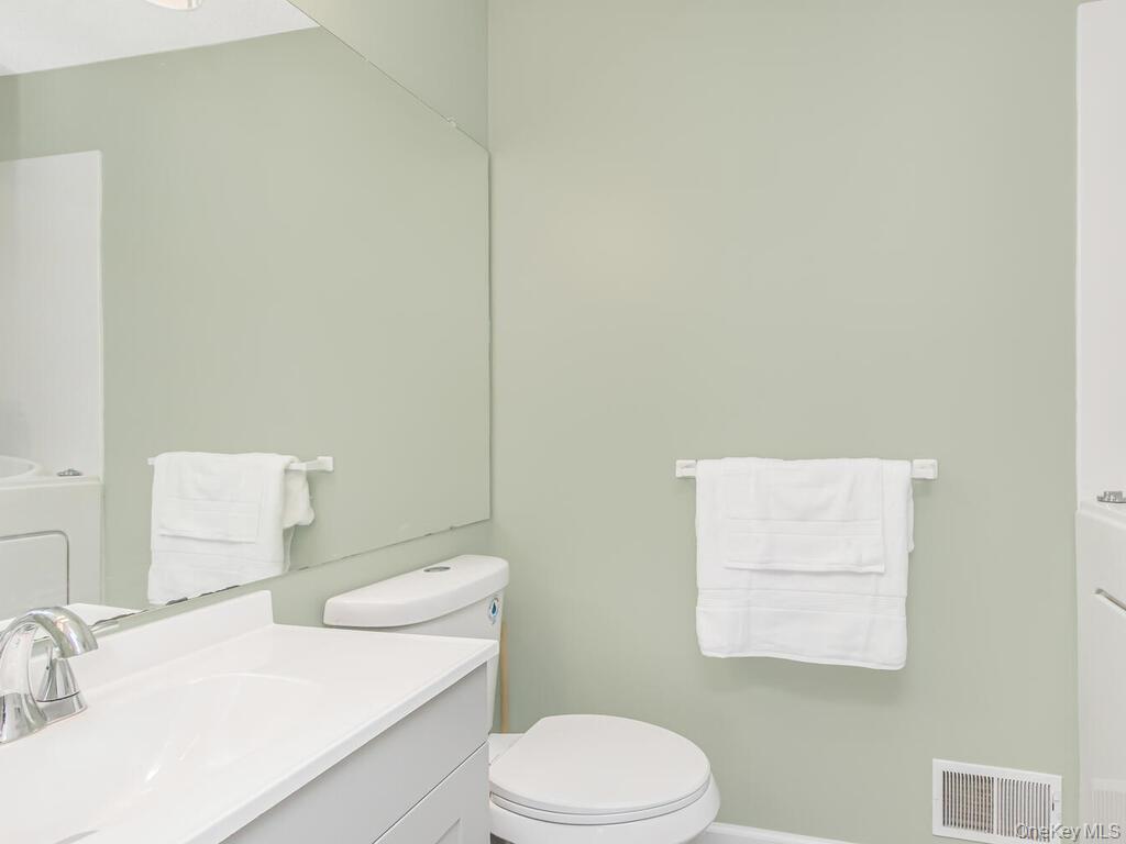 31 Winchester Avenue Peekskill, NY 10566 - Photo 18 of 33 a bathroom with a sink a toilet and mirror