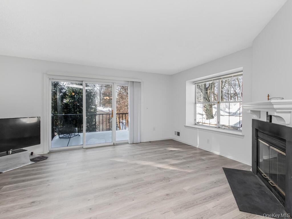 31 Winchester Avenue Peekskill, NY 10566 - Photo 19 of 33 a view of a livingroom with wooden floor and a flat screen tv