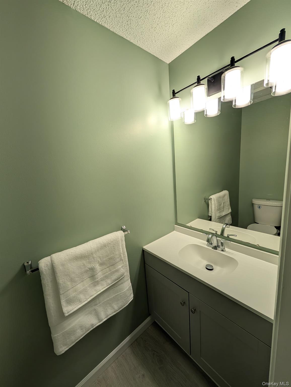 31 Winchester Avenue Peekskill, NY 10566 - Photo 31 of 33 a bathroom with a sink mirror and vanity