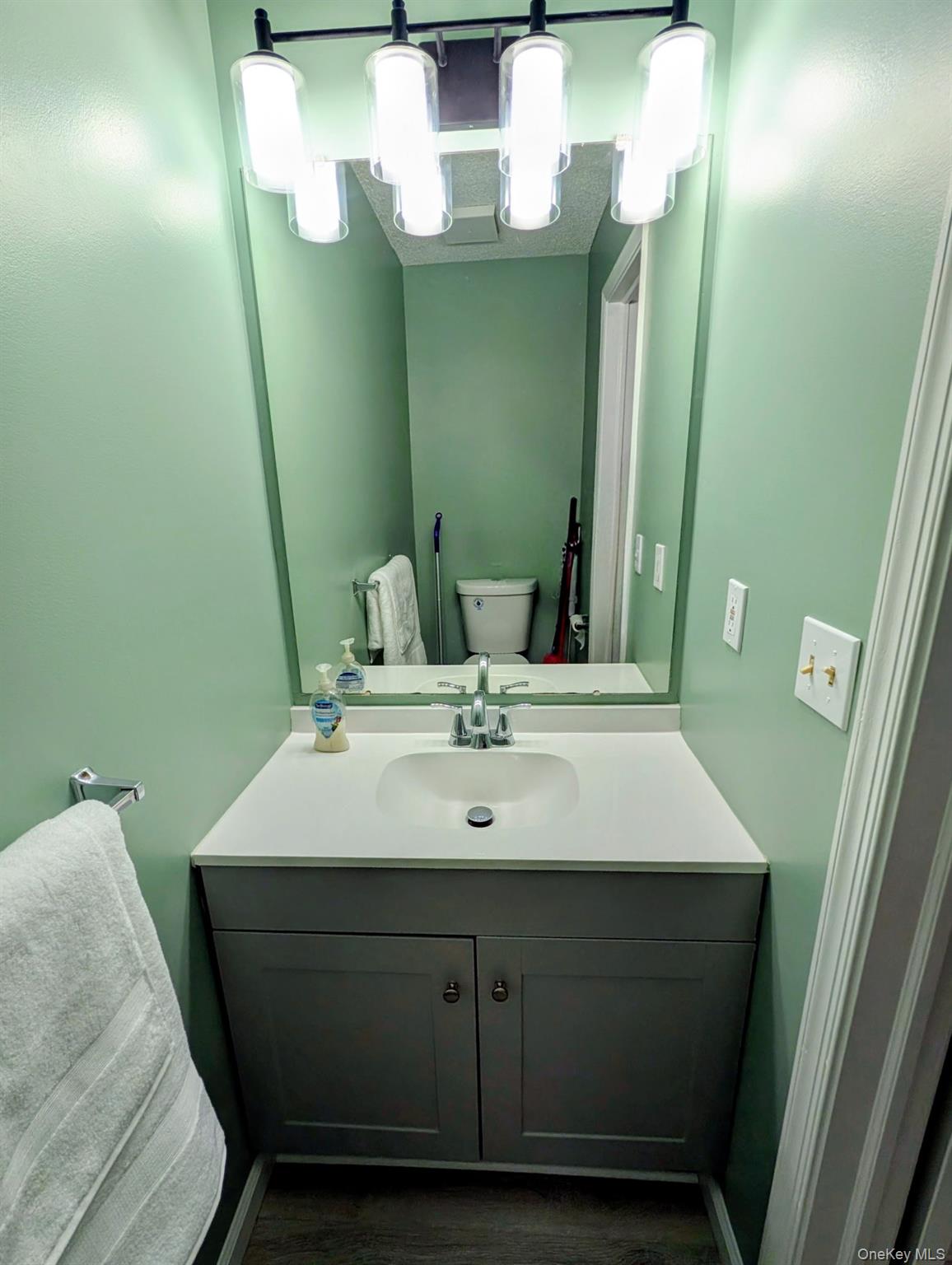 31 Winchester Avenue Peekskill, NY 10566 - Photo 32 of 33 a bathroom with a sink and a mirror