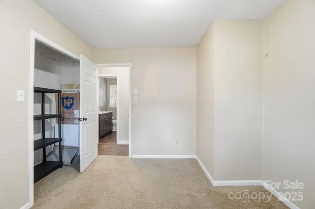 a view of a bedroom with closet