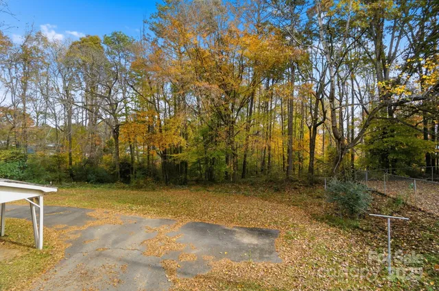 a view of a house with a snow on the road