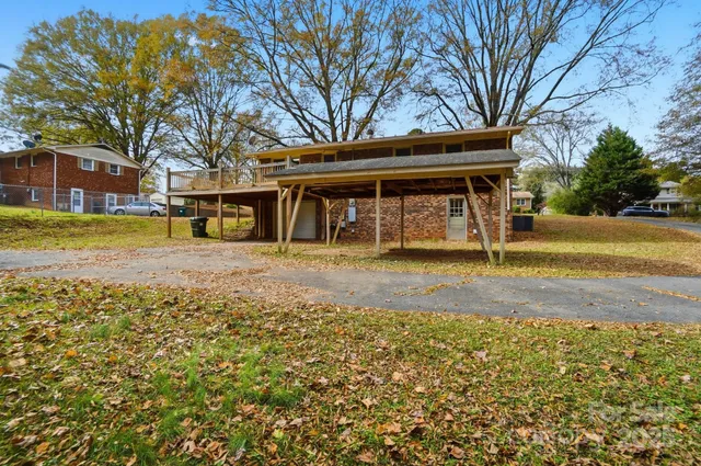 a backyard of a house with barbeque oven