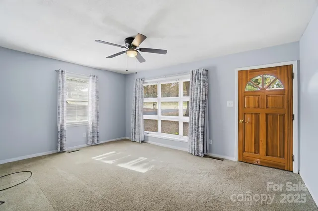 a view of empty room with windows
