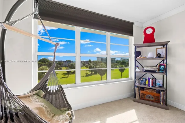 a bed room with furniture and a window