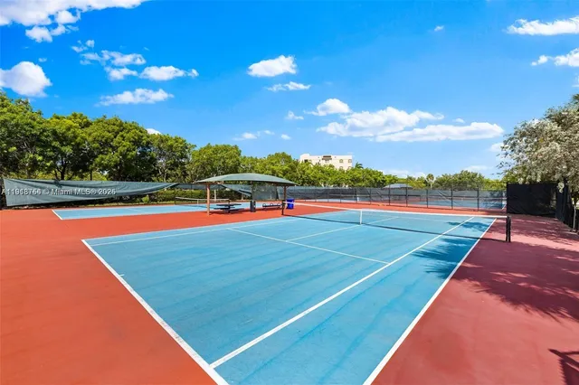 a view of an outdoor space and tennis court