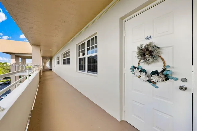 a view of a house with a potted plant