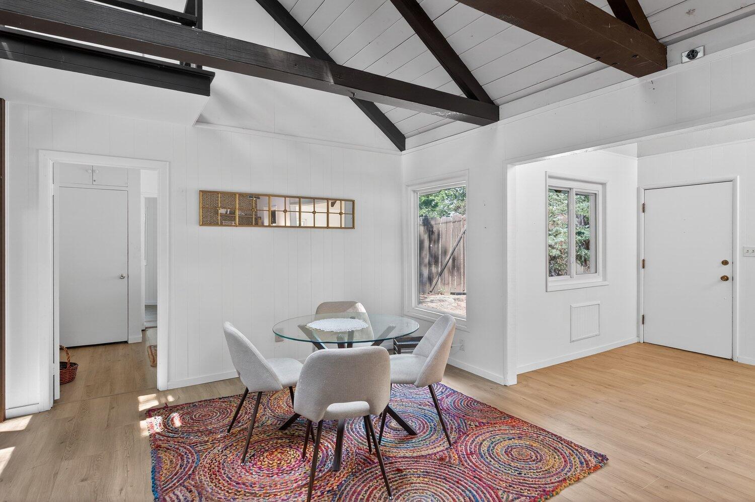 52230 Sylvan Way Idyllwild, CA 92549 - Photo 11 of 35 a view of a dining room with furniture and wooden floor
