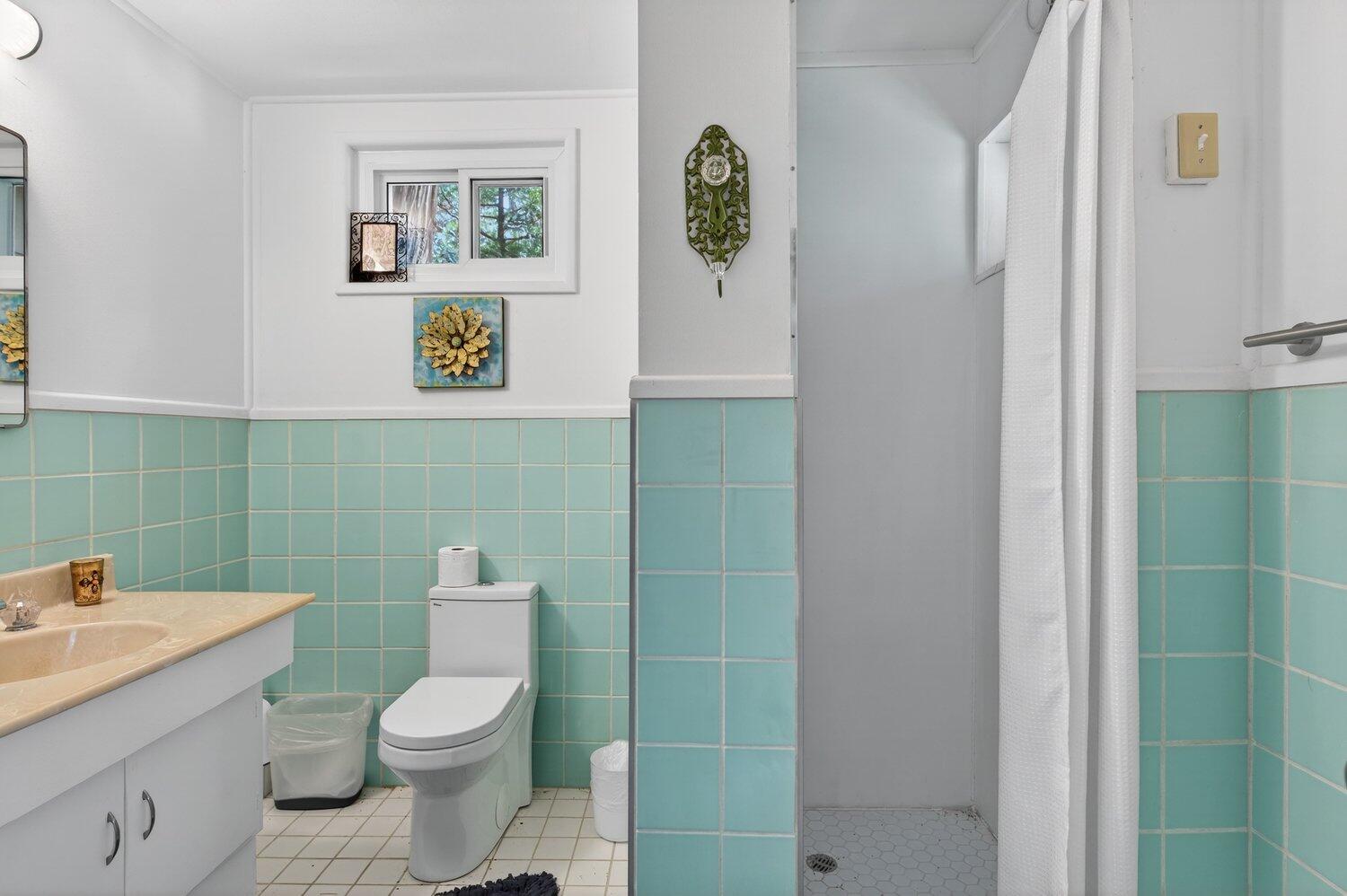 52230 Sylvan Way Idyllwild, CA 92549 - Photo 17 of 35 a bathroom with a toilet sink and mirror
