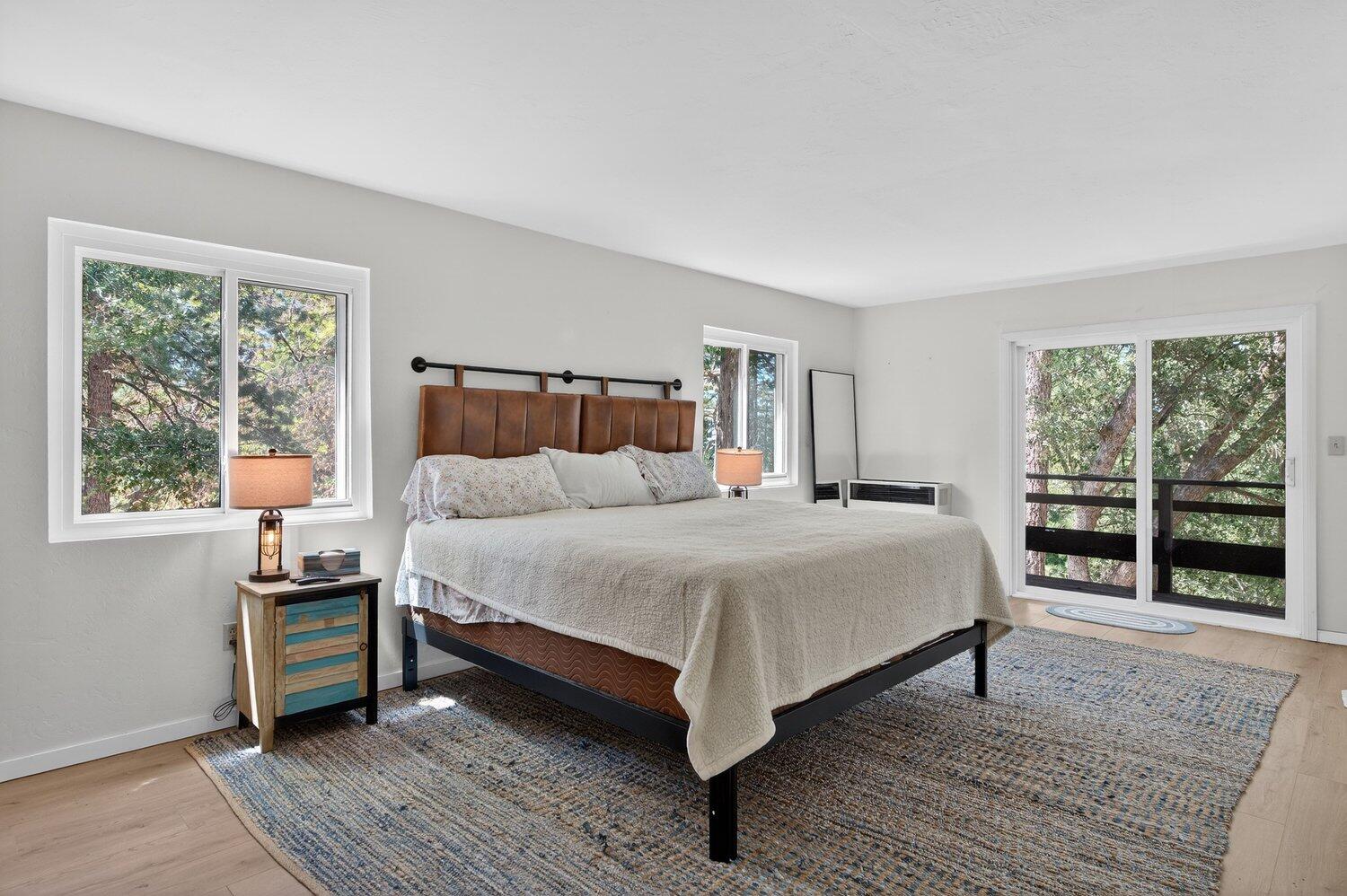 52230 Sylvan Way Idyllwild, CA 92549 - Photo 21 of 35 a bedroom with a bed wooden floor and window