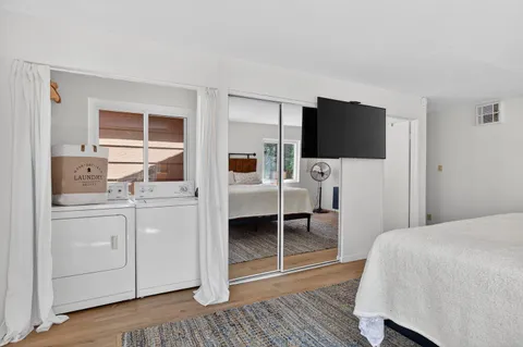 a bedroom with a bed and a television