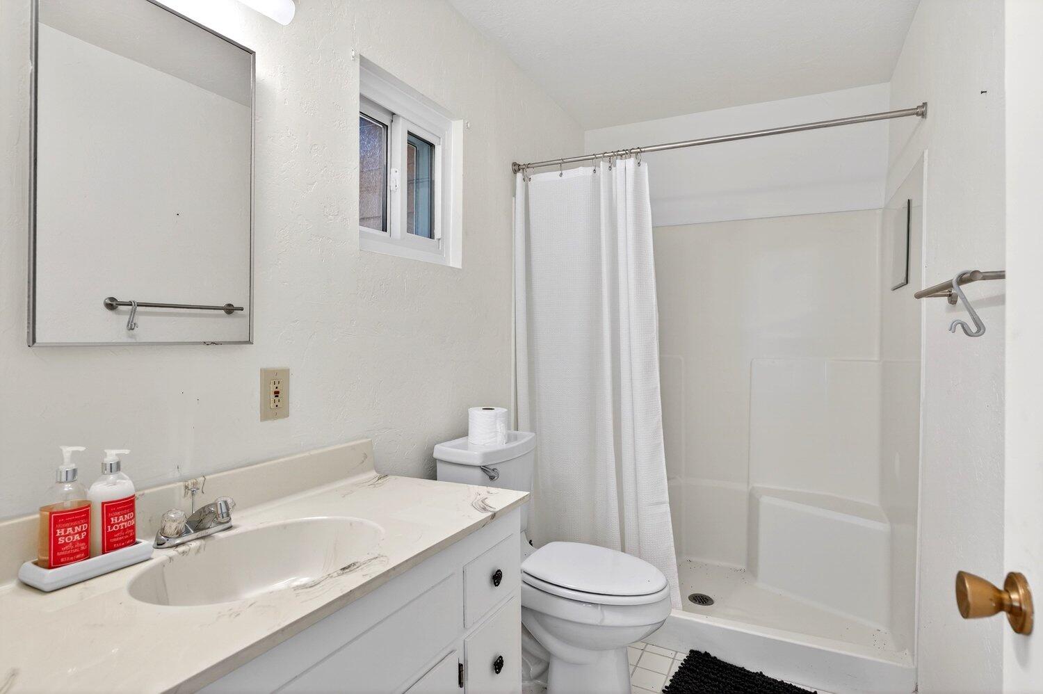 52230 Sylvan Way Idyllwild, CA 92549 - Photo 24 of 35 a bathroom with a sink toilet and shower