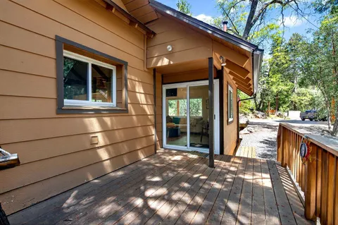 a backyard of a house with oven and tree