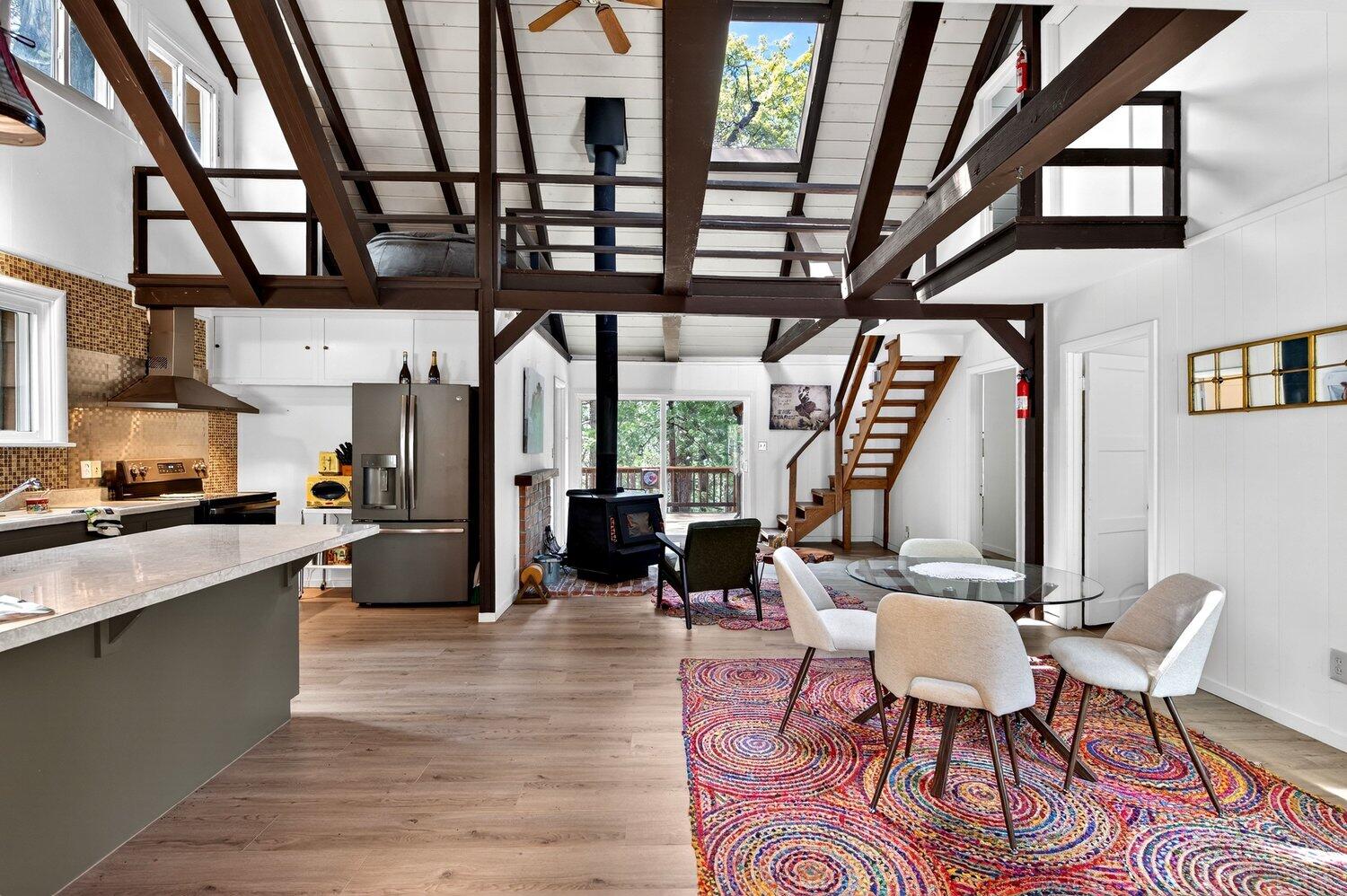 52230 Sylvan Way Idyllwild, CA 92549 - Photo 9 of 35 a view of a dining room with furniture window and wooden floor