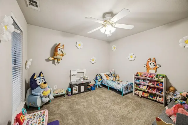 a bedroom with toys and a wooden floor