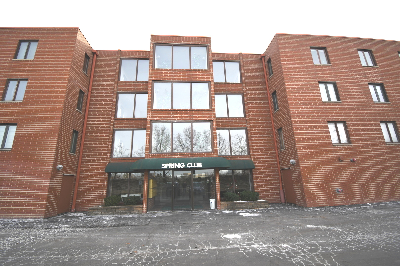 a front view of a building with a street