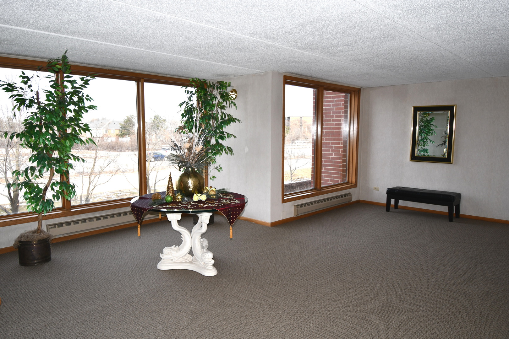 1S095 Spring Road, Unit H2 Oakbrook Terrace, IL 60181 - Photo 12 of 40 a living room with furniture and a large window