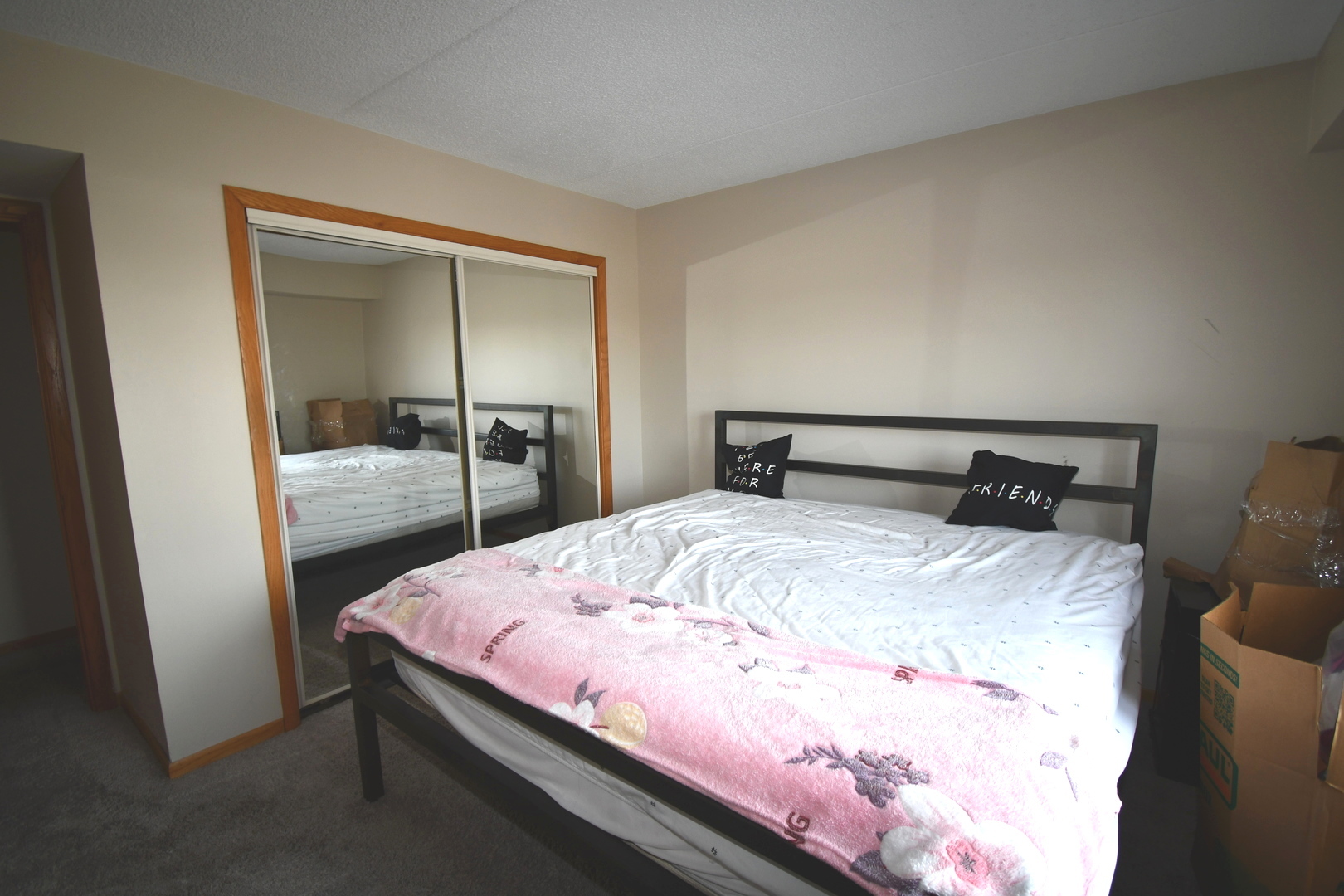 1S095 Spring Road, Unit H2 Oakbrook Terrace, IL 60181 - Photo 25 of 40 a bedroom with a bed and dresser with mirror
