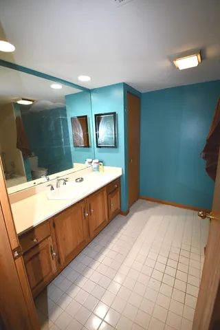 a bathroom with a sink double vanity and a mirror