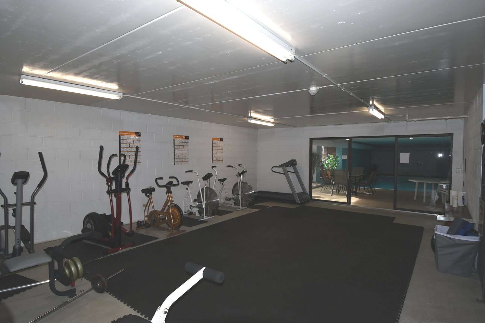 1S095 Spring Road, Unit H2 Oakbrook Terrace, IL 60181 - Photo 39 of 40 a room with gym equipment and large mirror