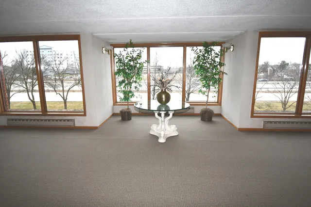 a view of empty room with floor to ceiling window