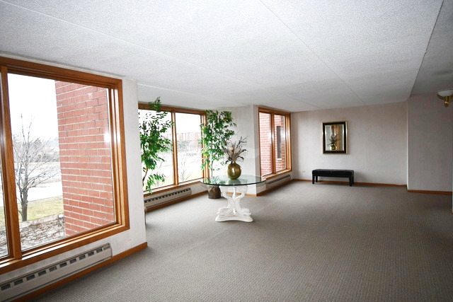 1S095 Spring Road, Unit H2 Oakbrook Terrace, IL 60181 - Photo 10 of 40 a view of empty room with floor to ceiling window and floor to ceiling window