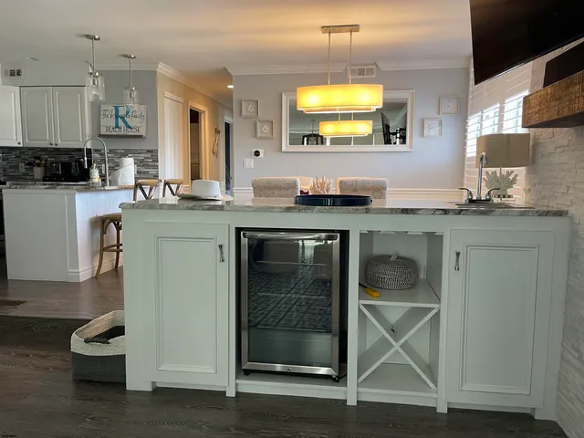 a kitchen with a sink cabinets and window