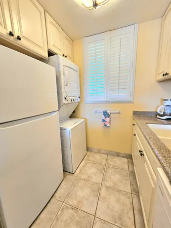 a utility room with a sink a washer and dryer