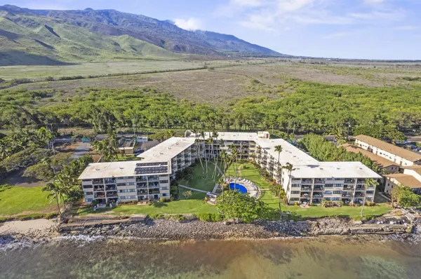 a aerial view of a house with a ocean view