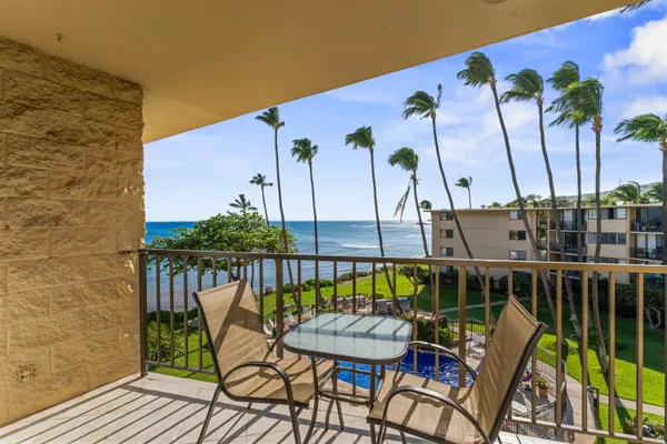 a view of a chairs and table in patio