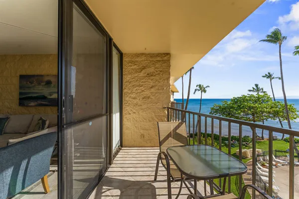a view of a balcony with furniture