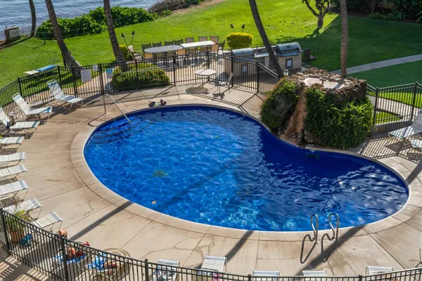 a view of a swimming pool with a patio