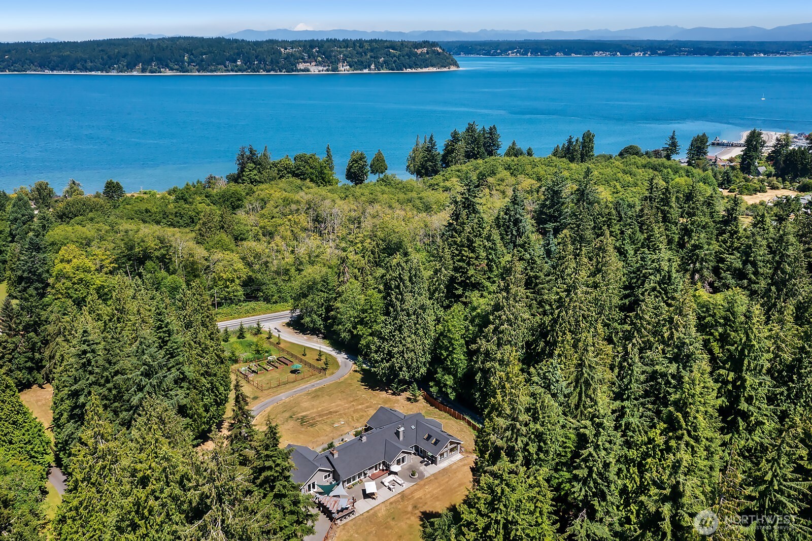 an aerial view of a houses with a lake view