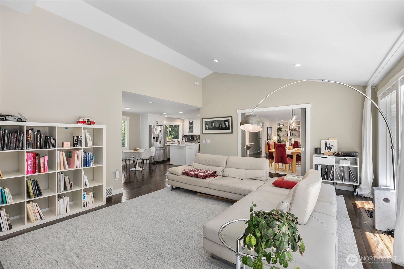 971 Sandy Point Road Langley, WA 98260 - Photo 12 of 35 a living room with furniture and a book shelf
