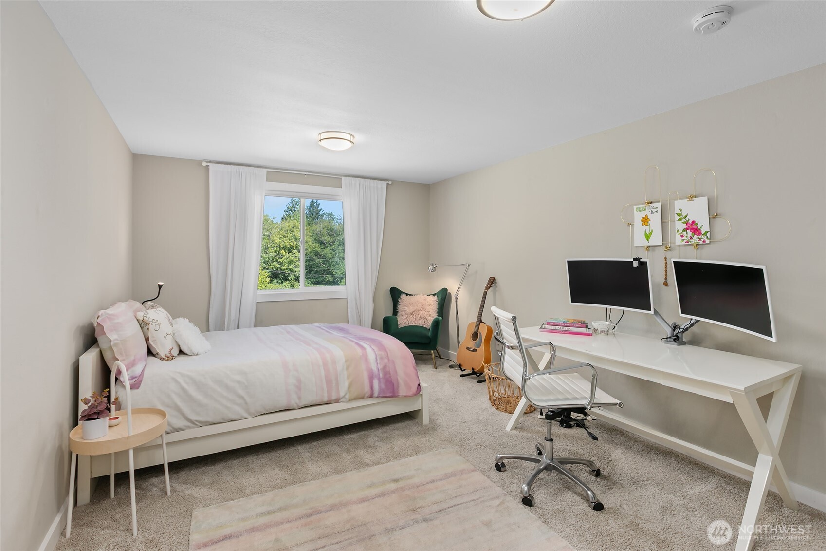 971 Sandy Point Road Langley, WA 98260 - Photo 18 of 35 a bedroom with a bed and a desk