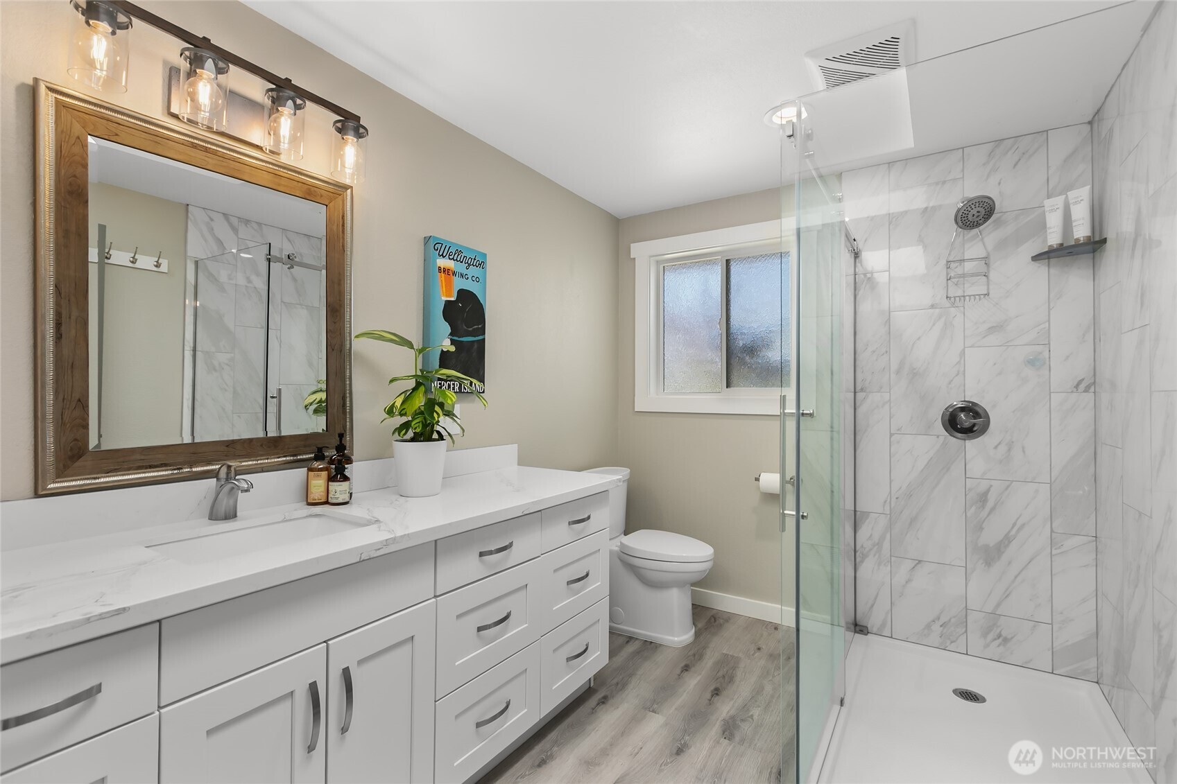 971 Sandy Point Road Langley, WA 98260 - Photo 19 of 35 a bathroom with a double vanity sink toilet and shower