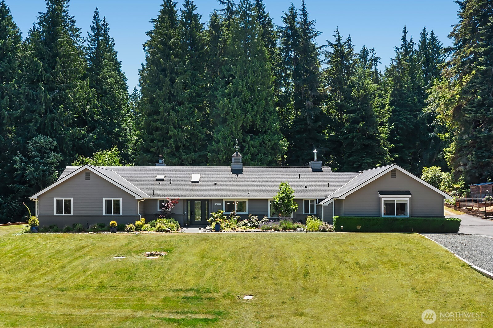 971 Sandy Point Road Langley, WA 98260 - Photo 2 of 35 a front view of house with yard and green space