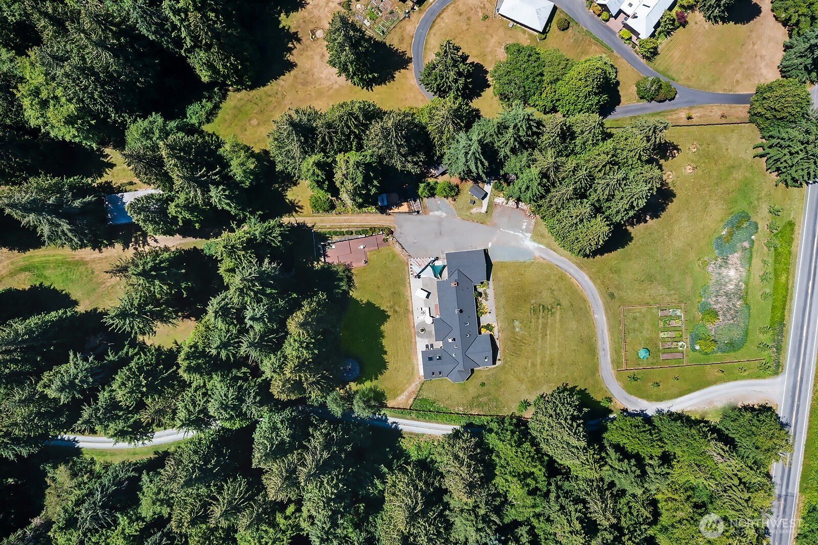 971 Sandy Point Road Langley, WA 98260 - Photo 34 of 35 an aerial view of a house with a garden