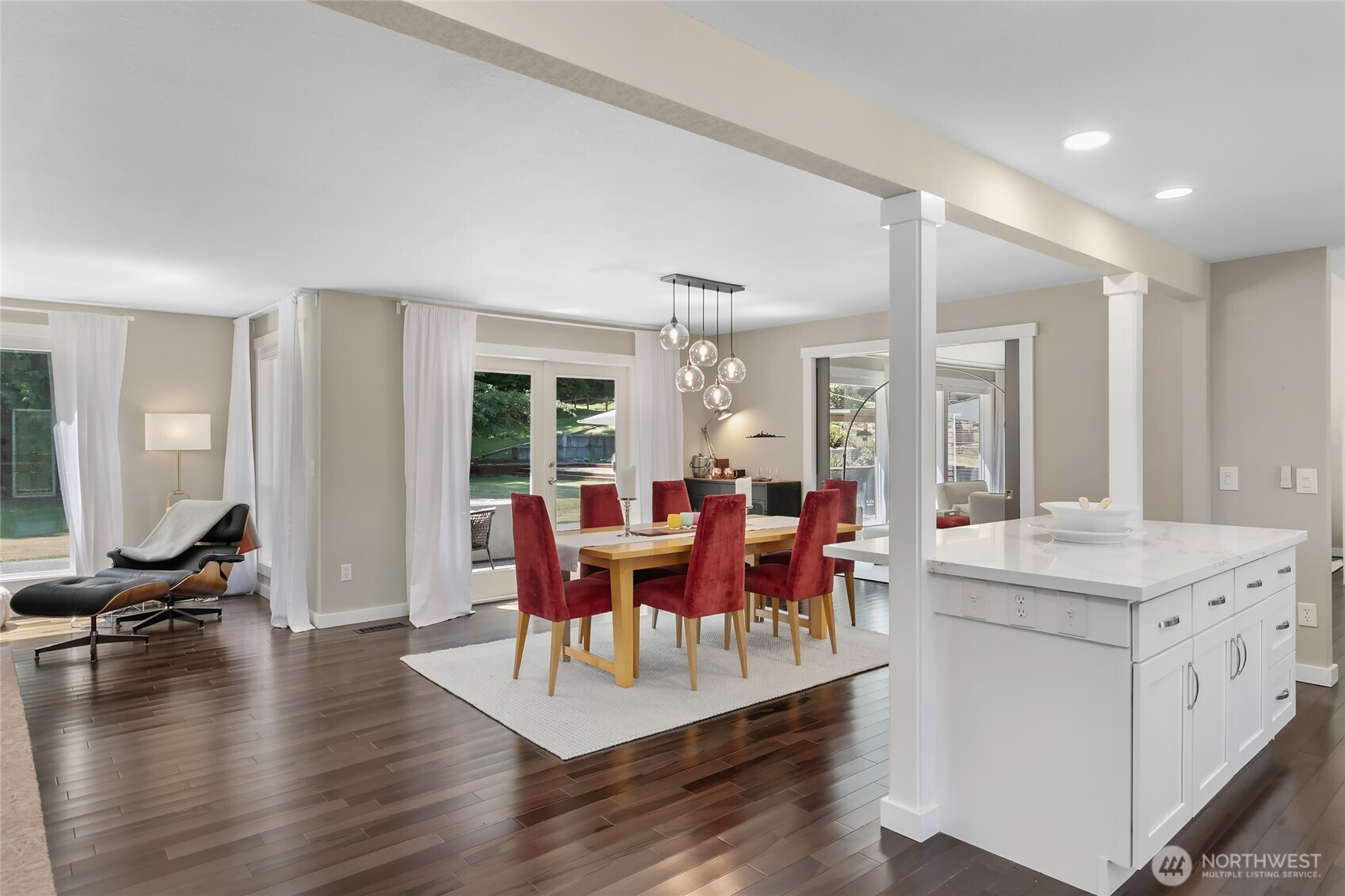 971 Sandy Point Road Langley, WA 98260 - Photo 4 of 35 a view of a dining room with furniture window and wooden floor
