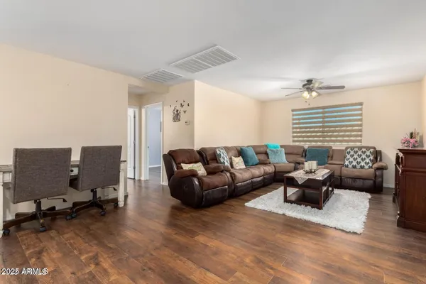 a living room with furniture or couch and a window