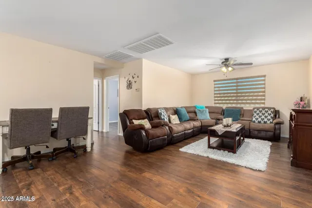 a living room with furniture or couch and a window