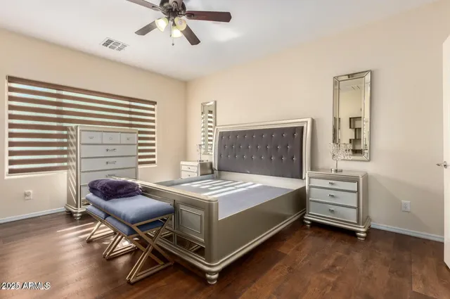 a bedroom with a bed and a chair