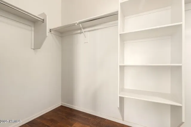 a view of an empty walk in closet