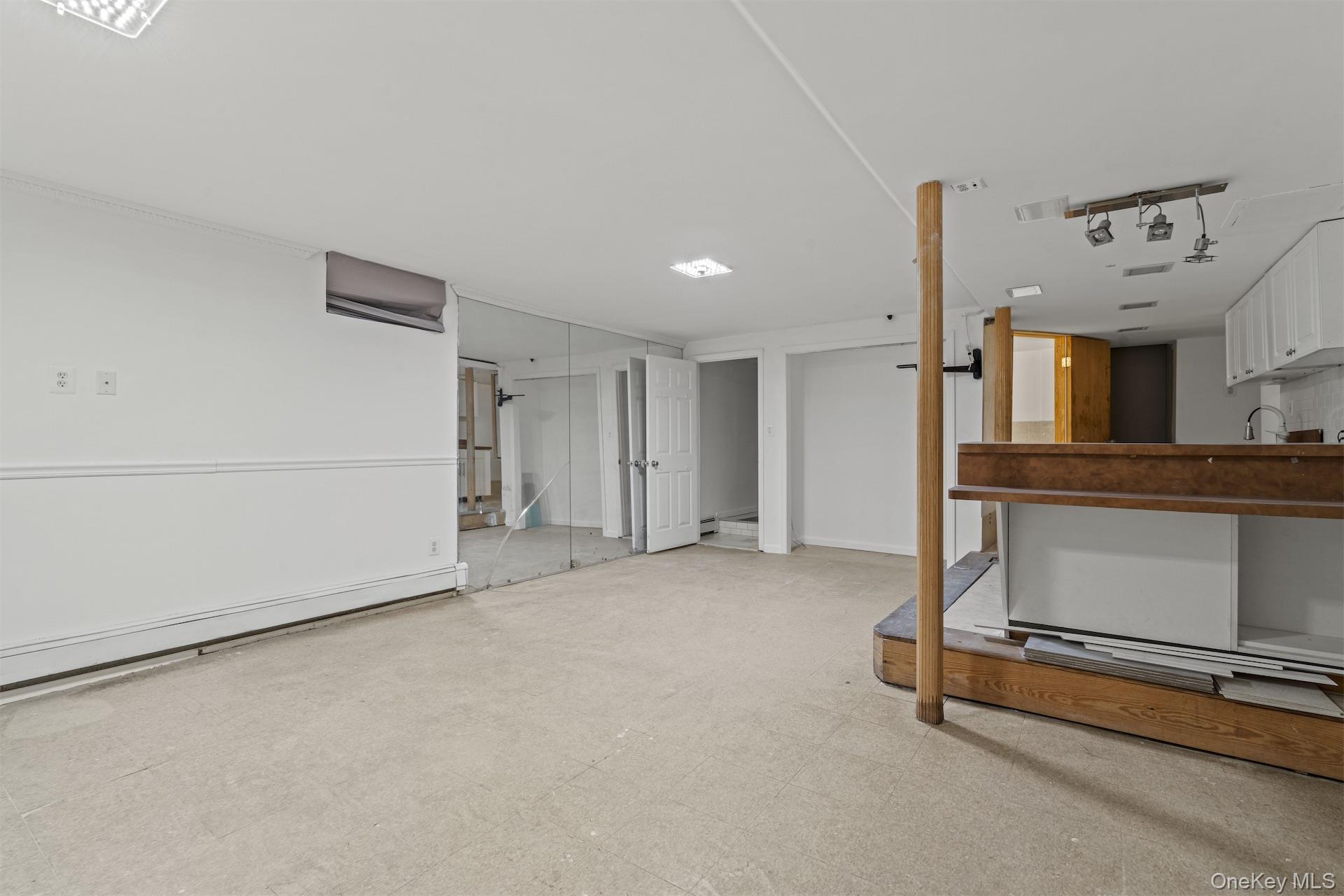 44 Decatur Street, Unit 1 Brooklyn, NY 11216 - Photo 16 of 18 a livingroom with furniture and a fireplace