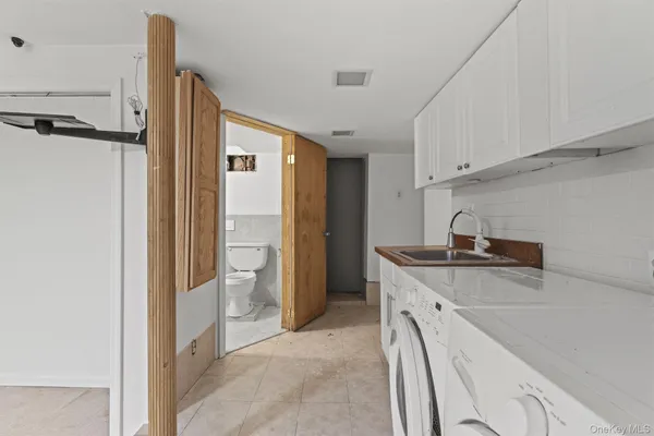 a kitchen with a sink and a refrigerator